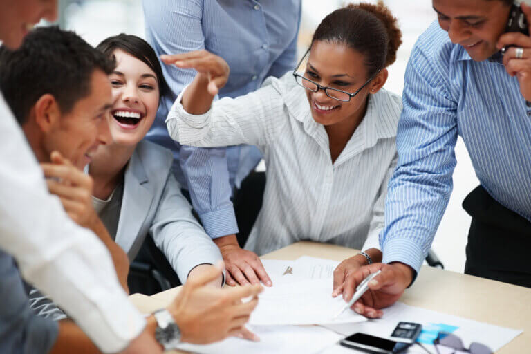 Smiling business people working together at a meeting